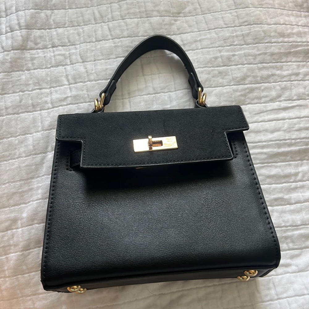 francesca’s black and gold purse
